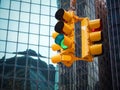 View on wall street yellow traffic light with black and white pointer guide. Green traffic light to Wall street banks money dollar Royalty Free Stock Photo