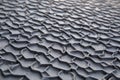 view of a warehouse storing stacks of rubber mat rolls