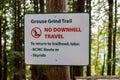 Warning sign along the Grouse Grind Trail in Vancouver indicating that downhill travel is prohibited Royalty Free Stock Photo