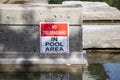 View of warning sign No trespassing in pool area Royalty Free Stock Photo