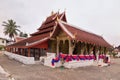 View of Wat Mai Suwannaphumaham & its distinctive tiered roof, a Buddhist temple in Luang Prabang, Laos