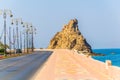 View of a watch tower behind the al riyam park in Muttrah district of Muscat, Oman Royalty Free Stock Photo