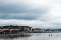 View of water, boats and buildings in Malahide village, Ireland with a cloudy sky in the background Royalty Free Stock Photo