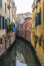 View of the water channels, bridges and old palaces in Venice at sunrise during the lockdown