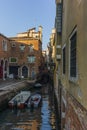 View of the water channels, bridges and old palaces in Venice at sunrise during the lockdown