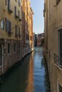 View of the water channels, bridges and old palaces in Venice at sunset