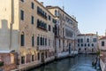 View of the water channels, bridges and old palaces in Venice at sunset