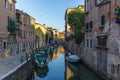 View of the water channels, bridges and old palaces in Venice at sunset