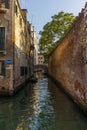 View of the water channels, bridges and old palaces in Venice at sunset