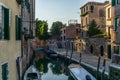 View of the water channels, bridges and old palaces in Venice at sunset