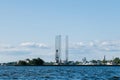 View from the water on the coastline of Kronstadt, cargo ships,Floating drilling rig, drilling cranes. Russia, Kronstadt