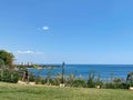 View of the water through the fence of the embankment. Classic terrace with decorative fence and sea view on waterfront