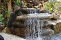 View of a water fountain made with stones in a restaurant Royalty Free Stock Photo