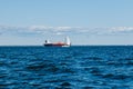 A view from the water of the Gulf of Finland on a summer day, cargo ships and yachts are sailing in the distance, blue Royalty Free Stock Photo