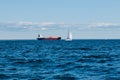 A view from the water of the Gulf of Finland on a summer day,cargo ships and yachts are sailing in the distance,blue Royalty Free Stock Photo