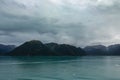 A view of mountains and icebergs in the Wrangell National Park outside of Hubbard Glacier Alaska from a cruise ship Royalty Free Stock Photo