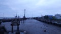 the view of the water on the pier recedes and looks dry