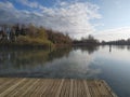 view of the water of a river, with reflection of trees and Sky