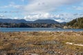 View of water and seaside town in mountains