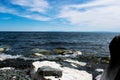 View of the water from the shore . the rock at the lake.