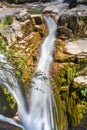 view of a waterfall flowing between rocks and creating moss with water in silk effect or blur in a natural park called AÃÂ±isclo in Royalty Free Stock Photo