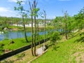 View on waterfall, mill in white building, pedestrian bridge in Park Postojna jama near Postojna Cave Royalty Free Stock Photo