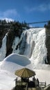 view of a waterfall under a beautiful winter day in Quebec Canada Royalty Free Stock Photo