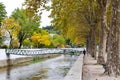 View of a wavy bridge over the river in Leiria city park at fall Royalty Free Stock Photo