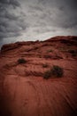 View of Wavy Stones Made with Red Rock, storm clouds in the sky Royalty Free Stock Photo