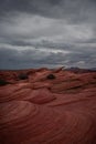 View of Wavy Stones Made with Red Rock, storm clouds in the sky Royalty Free Stock Photo