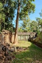 A view of the weathered stone walls of the ancient Ta Prohm temple standing resolutely in the heart of the Cambodian forest Royalty Free Stock Photo