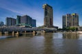 View of Webb bridge and business area buildings along Yarra river and south bank promenade, Melbourn