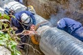 View on welding team of welders until them assembly a new pipeline Royalty Free Stock Photo