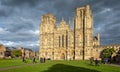 View of Wells Cathedral against dramatic stormy sky from Cathedral Green in Wells, Somerset, UK