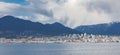 View on The West End of Vancouver across English Bay with cargo ships in overcast day Royalty Free Stock Photo