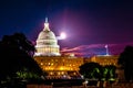 View of the west entrance of marble domed government building on Capitol Hill in Washington DC seat of Congress at nigh with Royalty Free Stock Photo