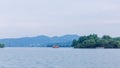 View of West Lake, with and hills and boats, in Hangzhou, China