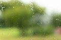 View through a wet glas, green unsharp background Royalty Free Stock Photo