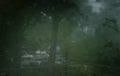 View through wet glass of window with raindrops Royalty Free Stock Photo