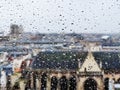 View through the wet window glass on roofs of Paris buildings Royalty Free Stock Photo