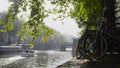 View of wheel bicycle on the Amsterdam amstel canal, next to floats tour boat, sunny european autumn Royalty Free Stock Photo