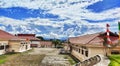 The view of white and blue clouds adorns the beauty of the Rasiei office building, teluk wondama regency, west papua province