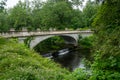 View of the White Bridge, spanning Crum Elbow Creek. It has an elegant arch, ornamented