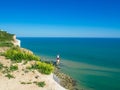 View of the white chalk headland cliffs and Beachy Head Lighthouse in the Seven Sisters National park, Eastbourne, England. Royalty Free Stock Photo