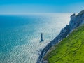 View of the white chalk headland cliffs and Beachy Head Lighthouse in the Seven Sisters National park, Eastbourne, England. Royalty Free Stock Photo