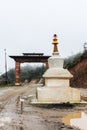 View of a white Chorten (Stupa) in a rainy day near Bumthang, Bhutan. Royalty Free Stock Photo