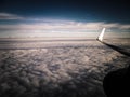 View of white clouds and plane enginie and wing Royalty Free Stock Photo