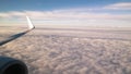 View of white clouds and plane enginie and wing Royalty Free Stock Photo