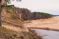 View of white dune where river flows to the sea