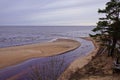 View from white dune where river flows to the sea